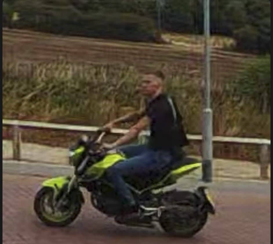 Man on a motorbike. He is described as a white man, in his 20s, around 6ft tall, and of a slim build, with light brown hair in a buzz cut, and a goatee