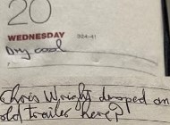 A photo of an old diary with writing 