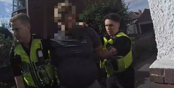 Officers arrest a man in Doncaster. His face is blurred