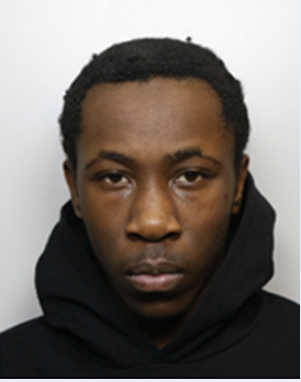 mugshot of a boy wearing a black hoodie