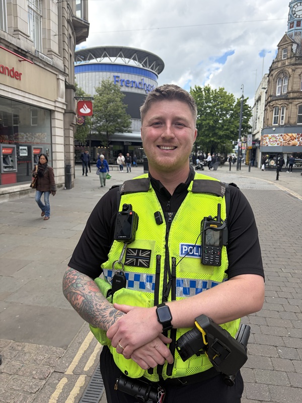 PC Jake Hale smiles as he carries out a patrol in Doncaster city centre