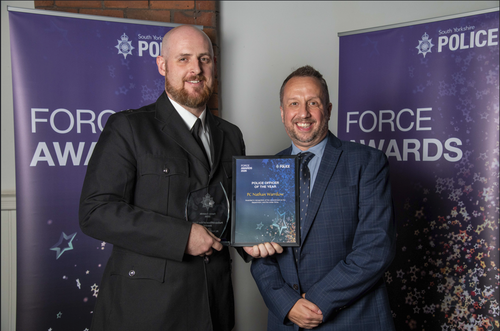 Nathan Warrilow receiving his award.