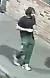 CCTV image of a man with dark hair