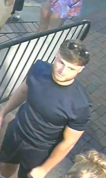 A man with sunglasses on his head