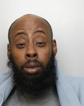 Image of a bald man with a thick beard