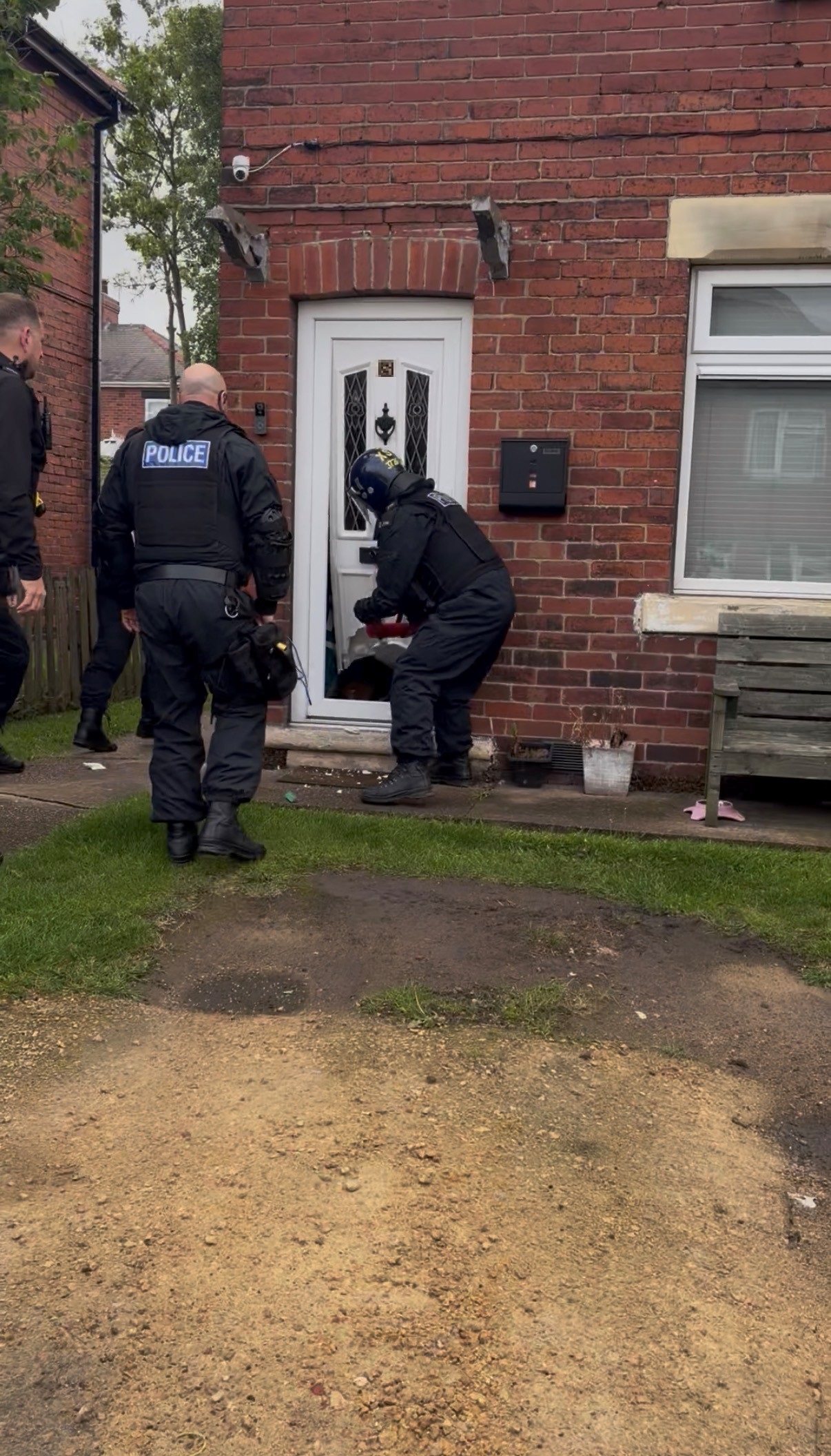 Officers knocking a door in