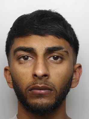 A mug shot photo of Hamza Hussain- staring at the camera with no expression