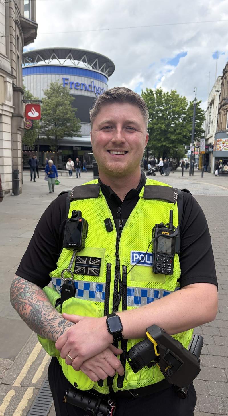 Police officer Jake Hale smiles as he stands for a picture in Doncaster city centre