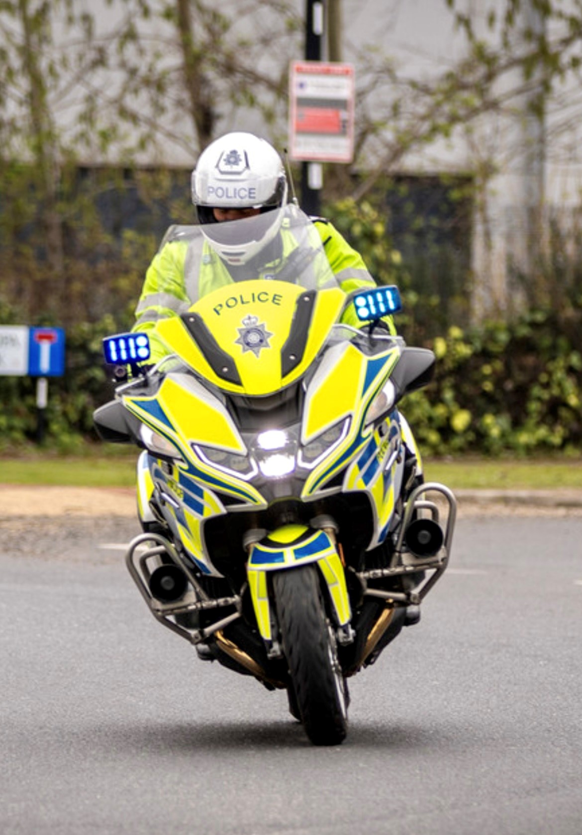 An image of a police officer on a police motorcycle 