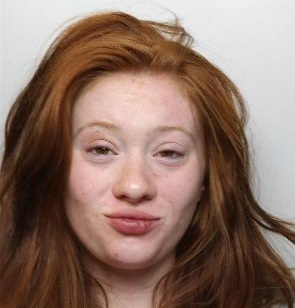 Abigail is a white woman in her 20s with long ginger hair