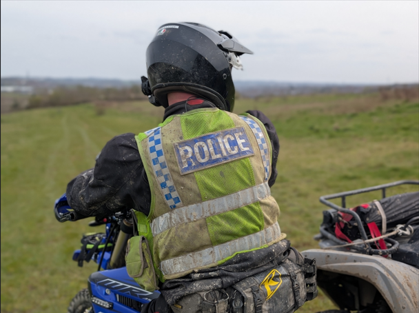 Man on motorbike in rural area 
